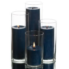 three blue candles sitting next to each other