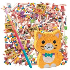 a cat made out of candy sticks and candies