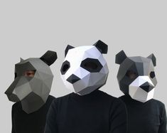 three people with panda masks on their faces