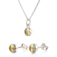 Beautiful Jewellery Set with Peridot gemstone made in sterling silver.  Crystal gemstone, an olive color to bright green, is believed to protect from dark energy. It is also called as an evening emerald because of the way it glows in the night. Peridot is the birthstone of August and an ideal gift for 16th marriage anniversary.  The set consists of birthstone earring studs and pendant necklace.   The necklace comes in 16" and 18" fine curb chain Please avoid in contact with chemicals and use silver cloth to clean. Birthstone Earrings Studs, Dark Energy, Marriage Anniversary, August Birthstone Jewelry, Forever Jewelry, August Birthstone, Jewellery Store, Earring Studs, Peridot Gemstone