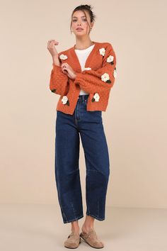 We know that the Lulus Chosen Charm Rust Orange Knit Embroidered Cardigan Sweater will always be your first pick when it comes to showing off your style! Cozy, heavy-gauge knit shapes this eye-catching cardigan sweater that features three-dimensional, crocheted floral embroidery throughout. Long balloon sleeves (with drop shoulders and fitted cuffs) frame a wide-cut, open-front bodice. Ribbed knit accents the neckline, cuffs, and hem. Fit: This garment fits true to size. Length: Size medium meas Trendy Embroidered Knit Sweater, Embroidered Knit V-neck Cardigan, Embroidered V-neck Knit Cardigan, Casual Embroidered Knit Outerwear, Casual Winter Cardigan With Floral Embroidery, Winter Floral Embroidered Knit Cardigan, Trendy Embroidered Fall Cardigan, Casual Embroidered Knit Cardigan, Embroidered Knit Cardigan For Fall