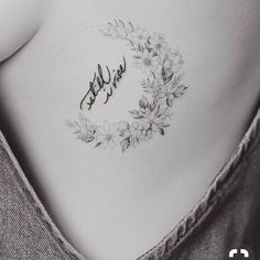 a woman's stomach with flowers and the word hello written on it in cursive writing