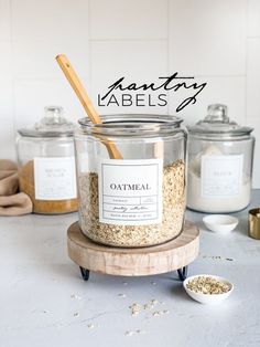 an open jar with oatmeal in it on a table next to other jars