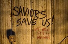 graffiti on the side of a building says savors save us