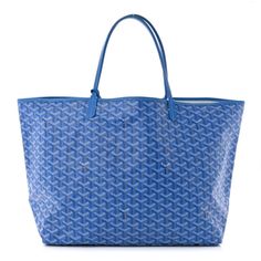 This is an authentic GOYARD Goyardine Saint Louis GM in Sky Blue. This lovely tote is crafted of classic Goyard goyardine chevron canvas in blue in the largest size. The bag features blue leather strap handles with leather top crest trim. The top is open to a spacious beige canvas interior and includes a matching removable pouch. Blue Coated Canvas Bags For Errands, Blue Coated Canvas Bag For Errands, Blue Coated Canvas Shoulder Bag, Blue Coated Canvas Shoulder Bag For Errands, Blue Goyard Bag, Go Yard Bag, Blue Goyard Tote, Unrealistic Wishlist, Goyard Tote Bag