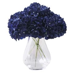 a vase filled with blue flowers on top of a table