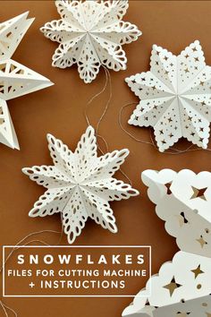 snowflakes that are cut out and stringed together