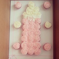 cupcakes are arranged in the shape of a dress