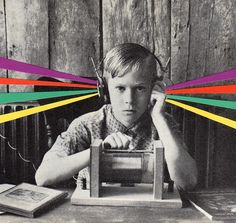 a black and white photo of a boy sitting at a table