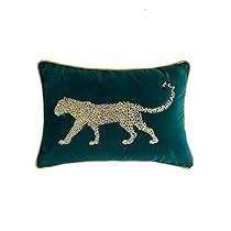 a green pillow with a white leopard on it