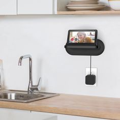 a wall mounted camera attached to the side of a kitchen counter