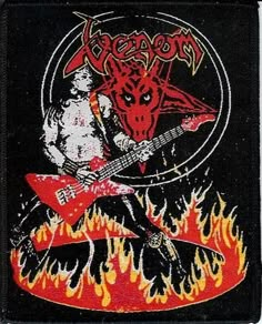 a patch with an image of a demon playing a guitar on fire in the background