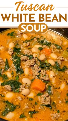 white bean soup with spinach and carrots in a bowl