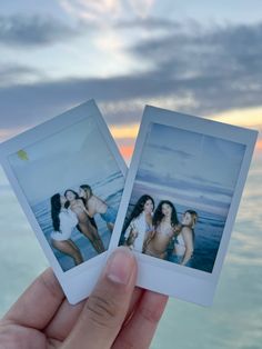 two polaroid photos being held in front of the ocean