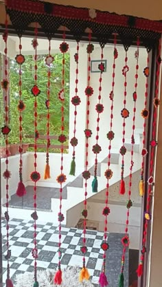 the door is decorated with colorful beads and tassels