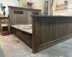 a bed frame made out of wood in a room