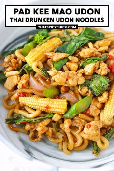 pad kee mao udon with chicken and vegetables on a white plate text overlay reads pad kee mao udon thai noodles