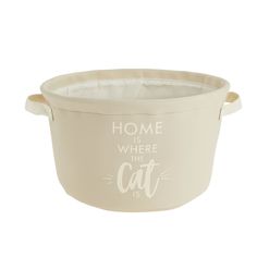 a white pot with the words home is where the cat is on it's side