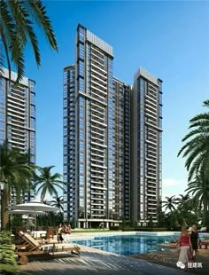 two tall buildings next to a swimming pool with people walking around it and palm trees in the foreground