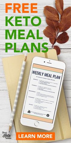 a tablet with the text free keto meal plans on it next to a notebook and pen