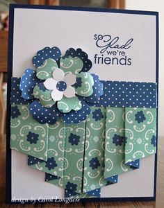 a close up of a card with a flower on the front and back of it