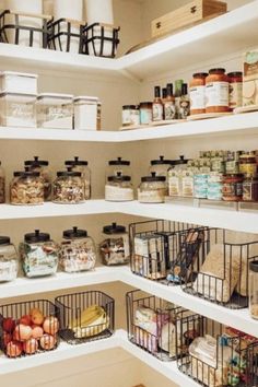 an organized pantry with lots of food in baskets and containers on the shelves, along with other items