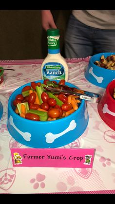 a table topped with blue bowls filled with food