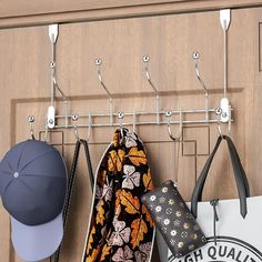 a coat rack with hats and purses hanging from it