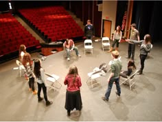 a group of people standing on top of a stage