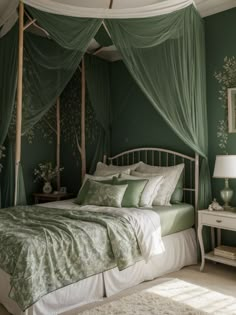 a bedroom with green walls and curtains on the windowsills, a white bed topped with pillows and blankets