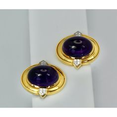 This is part of Chairish’s Fine Jewelry assortment.  David Webb Amethyst Cabochon Earrings 18K  These beautiful David Webb earrings feature Amethyst Cabochons that measure 20.71 cm x 16.5 cm. They are quite large and the surround measures 23cm x 28cm with a depth of 11.40. These stones are surrounded by 18K Yellow Gold with two side plaques with Diamonds done in platinum. As all David Webb pieces they are substantial and made beautifully these are no exception. These are not rare as I have seen Luxury Oval Cabochon Gemstone Earrings, Luxury Amethyst Earrings For Formal Occasions, Luxury Round Cabochon Clip-on Earrings, Luxury Purple Round Earrings, Elegant Purple Cabochon Earrings, Luxury Oval Cabochon Earrings For Anniversary, Luxury Gold Amethyst Earrings, Yellow Gold Amethyst Earrings Hallmarked, Elegant Purple Clip-on Earrings For Formal Occasions