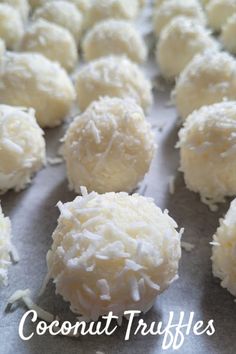 coconut truffles on a baking sheet with the words coconut truffles