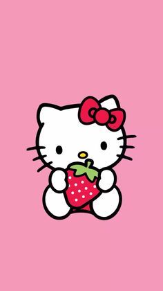 a hello kitty with a strawberry in her hand