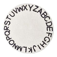 a white and black circular rug with the words abc, wyzny, dys