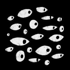 an image of many fish swimming in the dark water with one eye open and two eyes closed