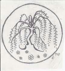 a black and white drawing of a plant in a circle with flowers on the side