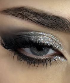 Siren Eyes Eyeshadow, Black Eyeshadow Looks With Glitter, Prom Makeup Silver Eyeshadow, Black Sparkly Eyeshadow, Smokey Eyeliner With Glitter, Black And Silver Makeup Ideas, Star Glitter Eye Makeup, Grey And Silver Eyeshadow, Dark Glitter Makeup Looks