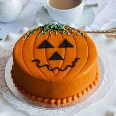 a decorated cake with pumpkin faces on it