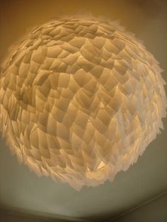 a round light fixture hanging from the ceiling