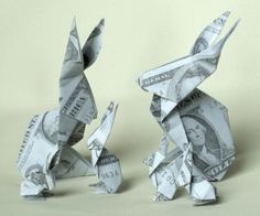 two origami rabbits made out of one dollar bill