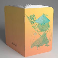 an open book with a drawing of a bird on it