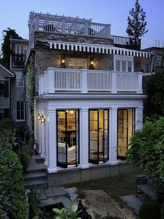 an exterior view of a house with lots of windows