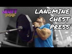 a man lifting a barbell with the words, land mine chest press on it