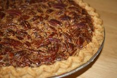 a pecan pie sitting on top of a wooden table