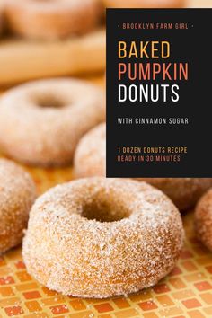 baked pumpkin donuts with cinnamon sugar on a table