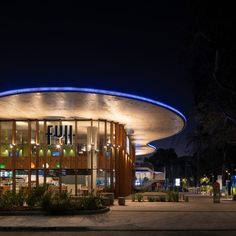 an illuminated building at night with the lights on