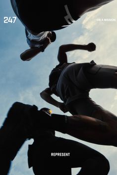 three skateboarders doing tricks in the air against a blue sky with white clouds