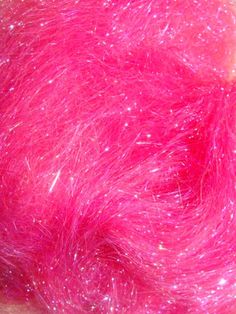 pink hair that has been dyed with red and white flecks on top of it