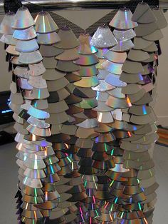 a sculpture made out of cds on top of a table