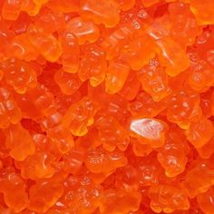 orange gummy bears sitting on top of each other